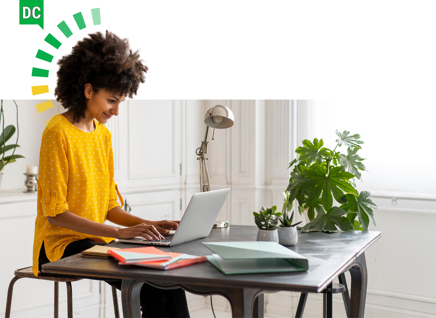 Woman working on a laptop with a DC DiSC style halo.